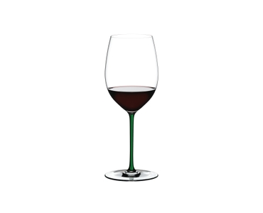 RIEDEL Fatto A Mano R.Q. Cabernet/Merlot Green filled with a drink on a white background