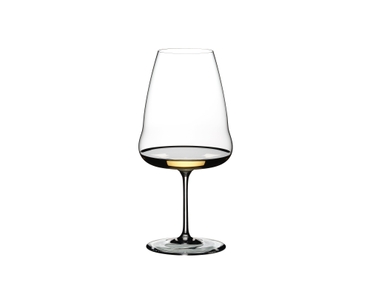 A RIEDEL Winewings Riesling glass filled with white wine on a white background.