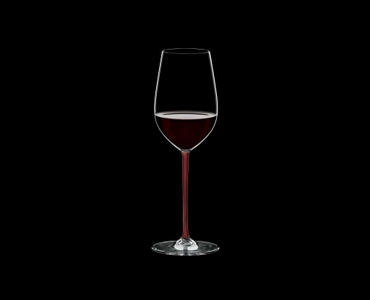RIEDEL Fatto A Mano Riesling/Zinfandel Red R.Q. filled with a drink on a black background