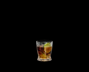 RIEDEL Tumbler Collection Fire Whisky filled with a drink on a black background