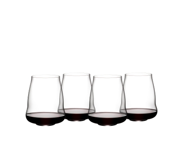 Four SL RIEDEL Stemless Wings Pinot Noir / Nebbiolo glasses filled with red wine stand side by side or slightly behind each other on a white background.
