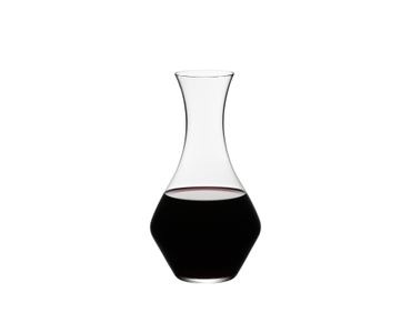 RIEDEL Decanter Cabernet filled with a drink on a white background