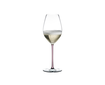A RIEDEL Fatto A Mano Champagne Wine Glass in pink filled with champagne on a transparent background. 