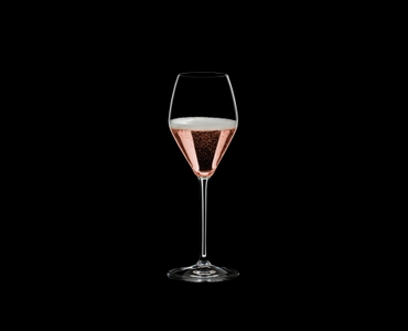 RIEDEL Extreme Restaurant Rosé/Champagne filled with a drink on a black background