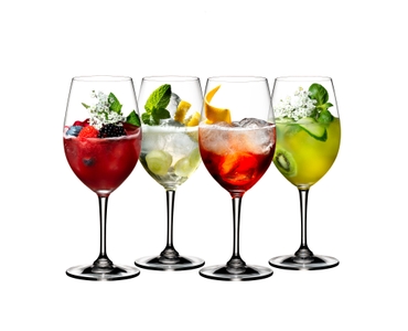 4 different decorated cocktails served in RIEDEL Spritz Drinks glasses standing slightly offset side by side