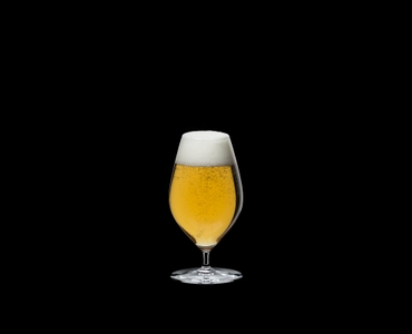 RIEDEL Veritas Restaurant Beer filled with a drink on a black background