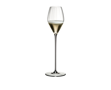 RIEDEL High Performance Champagne Glass Clear filled with a drink on a white background