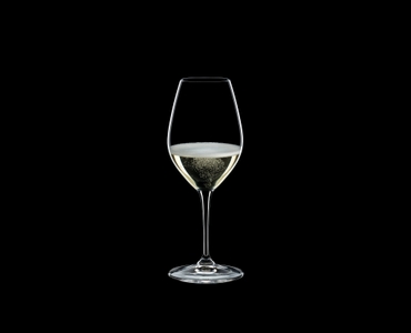 RIEDEL Vinum Restaurant Champagne Wine Glass filled with a drink on a black background