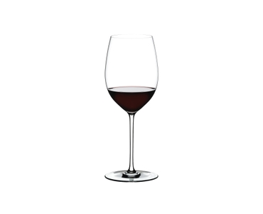RIEDEL Fatto A Mano Cabernet/Merlot filled with a drink on a white background