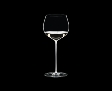 RIEDEL Fatto A Mano Oaked Chardonnay White R.Q. filled with a drink on a black background