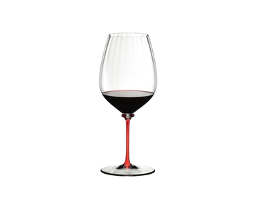 A RIEDEL Fatto A Mano Performance Cabernet Sauvignon glass with red stem fill with red wine.