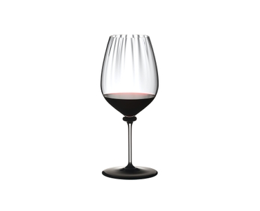 RIEDEL Fatto A Mano Performance Cabernet Black Base filled with a drink on a white background