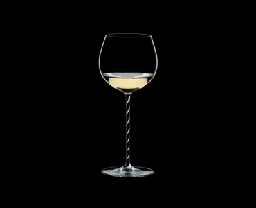 RIEDEL Fatto A Mano Oaked Chardonnay Black & White filled with a drink on a black background