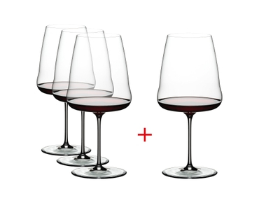 Three RIEDEL Winewings Cabernet/Merlot glasses plus one filled with red wine on a white background.