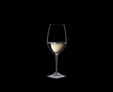 RIEDEL Restaurant Riesling/Zinfandel filled with a drink on a black background