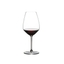 RIEDEL Extreme Shiraz filled with a drink on a white background