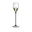 A RIEDEL High Performance Champagne Glass with a black stem filled with champagne on a transparent background. 
