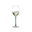 A RIEDEL Fatto A Mano Champagne Wine Glass in green filled with champagne on a transparent background. 