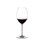 A RIEDEL Fatto A Mano Syrah glass in pink filled with red wine on a transparent background. 