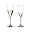 RIEDEL Vinum Vintage Champagne Glass filled with a drink on a white background