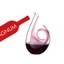 RIEDEL Curly Magnum Decanter - pink filled with a drink on a white background
