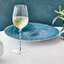 RIEDEL Fatto A Mano Champagne Wine Glass - blue white twisted - Hotel du Cap Eden Roc Edition in use