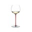 A RIEDEL Fatto A Mano Oaked Chardonnay glass in red filled with white wine on a transparent background. 
