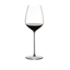 RIEDEL Max Cabernet filled with a drink on a white background