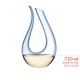 A RIEDEL Amadeo Decanter with a soft blue stripe of colour and filled with red wine on a white background.