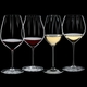 RIEDEL Performance Tasting Set filled with a drink on a black background