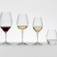 A RIEDEL Wine Friendly White Wine / Champagne Wine Glass on a white background with product dimensions: Height: 221 mm / 8.70 in, Biggest diameter: 85 mm / 3.35 in, Base diameter: 85 mm / 3.35 in.