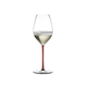 RIEDEL Fatto A Mano Champagne Wine Glass Red R.Q. filled with a drink on a white background