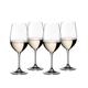 4 RIEDEL Vinum Riesling/Zinfandel glasses filled with white wine stand slightly offset side by side