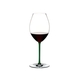 RIEDEL Fatto A Mano Syrah Green R.Q. filled with a drink on a white background