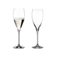 Two RIEDEL Vinum Vintage Champagne Glasses. One is unfilled, the other one is filled with Champagne.