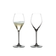 Two RIEDEL Heart to Heart Champagne Glasses. One is unfilled, the other one is filled with Champagne.