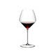 A RIEDEL Veloce Pinot Noir glass filled with red wine on a white background.