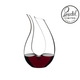 RIEDEL Decanter Amadeo Mini filled with a drink on a white background