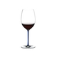 RIEDEL Fatto A Mano R.Q. Cabernet/Merlot Dark Blue filled with a drink on a white background