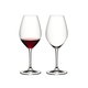 Two RIEDEL Ouverture Marie-Jeanne Glasses side by side. The glass on the left side is filled with red wine, the other one is empty.