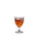 RIEDEL Tumbler Collection Fire All Purpose Glass filled with a drink on a white background