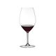 RIEDEL Ouverture Double Magnum filled with a drink on a white background