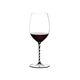 RIEDEL Fatto A Mano Cabernet/Merlot Black & White R.Q. filled with a drink on a white background