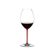 An unfilled RIEDEL Fatto A Mano Syrah red glass with a red stem on a white background with product dimensions.