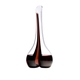 A RIEDEL Black Tie Smile Decanter Red with a black/red/black stripe and filled with red wine.
