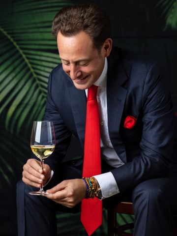man holding RIEDEL Sommeliers glass