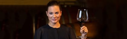 woman holding red wine glass