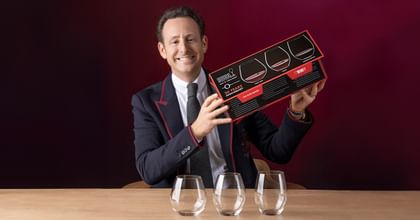 Maximilian J. Riedel holding RIEDEL Key to Wine set