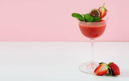 strawberry cocktail with pink background