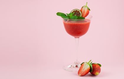 strawberry cocktail with pink background